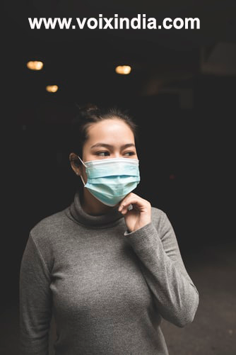 corona_girl-wearing-mask-voixindia